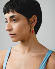 Gold hoop earrings with red chili pepper-shaped pendants made from recycled glass