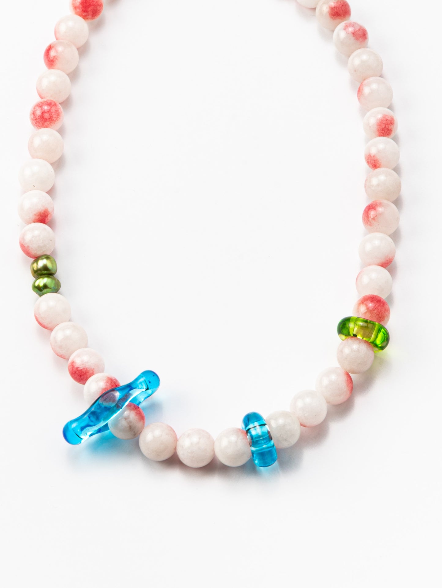 Necklace made of round pink-and-white gemstones, green river pearls and colorful recycled glass accents in blue and green, finished with a silver clasp