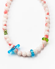 Necklace made of round pink-and-white gemstones, green river pearls and colorful recycled glass accents in blue and green, finished with a silver clasp