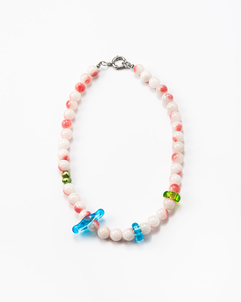 Necklace made of round pink-and-white gemstones, green river pearls and colorful recycled glass accents in blue and green, finished with a silver clasp