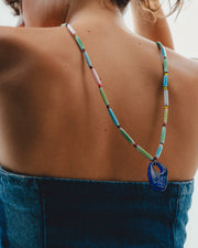 Colorful handmade  beaded necklace with a blue pendant 