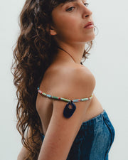 Colorful handmade  beaded necklace with a blue pendant 