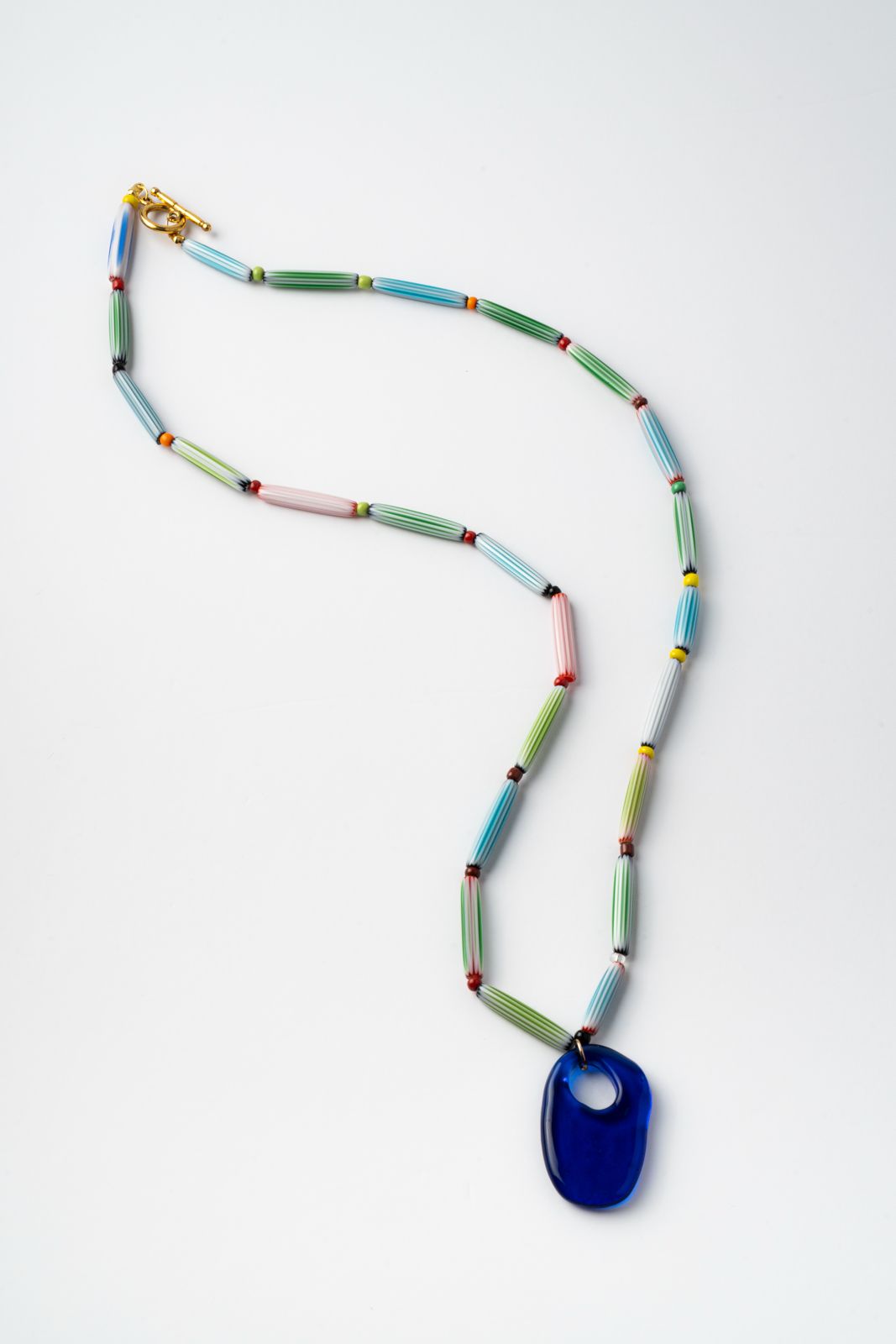 Colorful handmade  beaded necklace with a blue pendant 