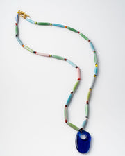 Colorful handmade  beaded necklace with a blue pendant 
