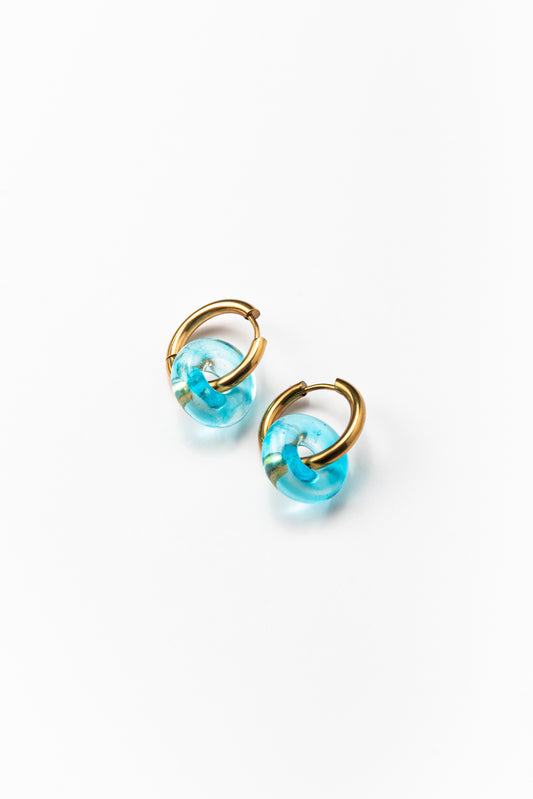 Lightblue hoop earrings on a base of gold stainless steel, made from recycled glass