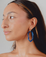 Dark blue Zostera dangle earrings on a base of gold stainless steel, made from recycled glass