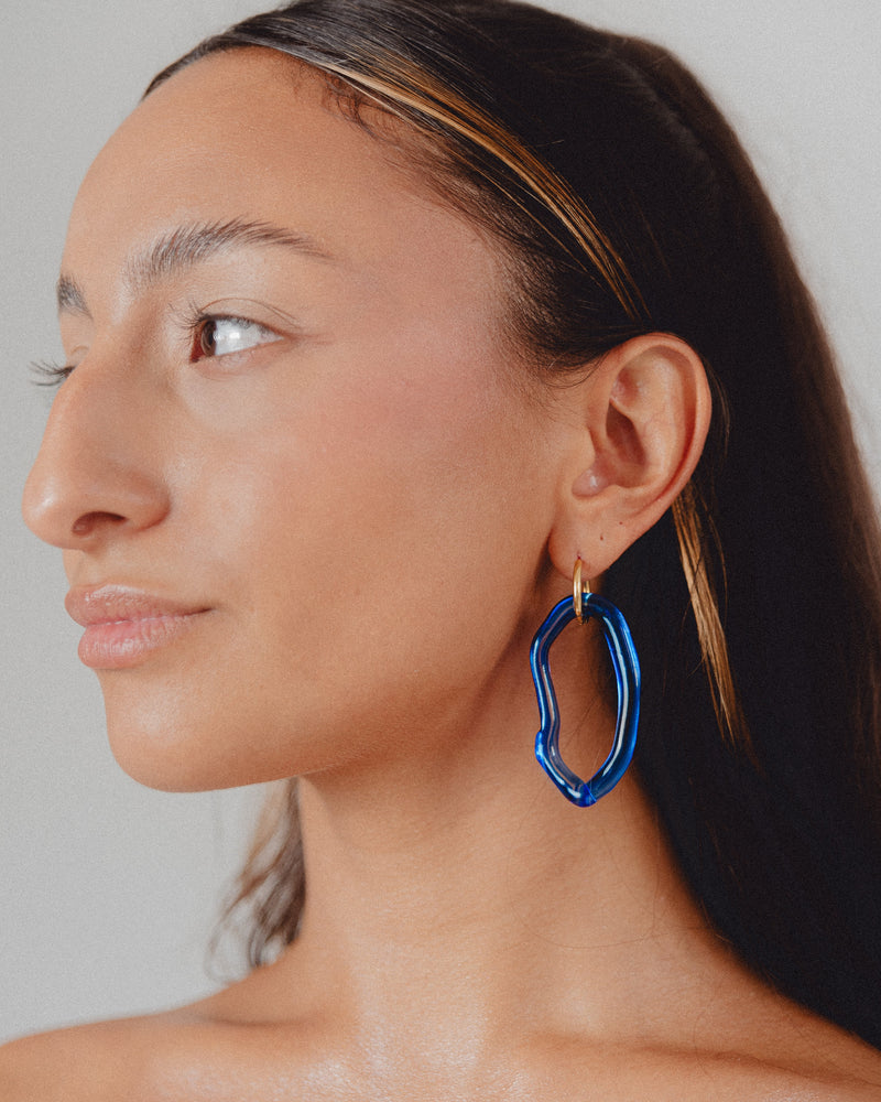 Dark blue Zostera dangle earrings on a base of gold stainless steel, made from recycled glass