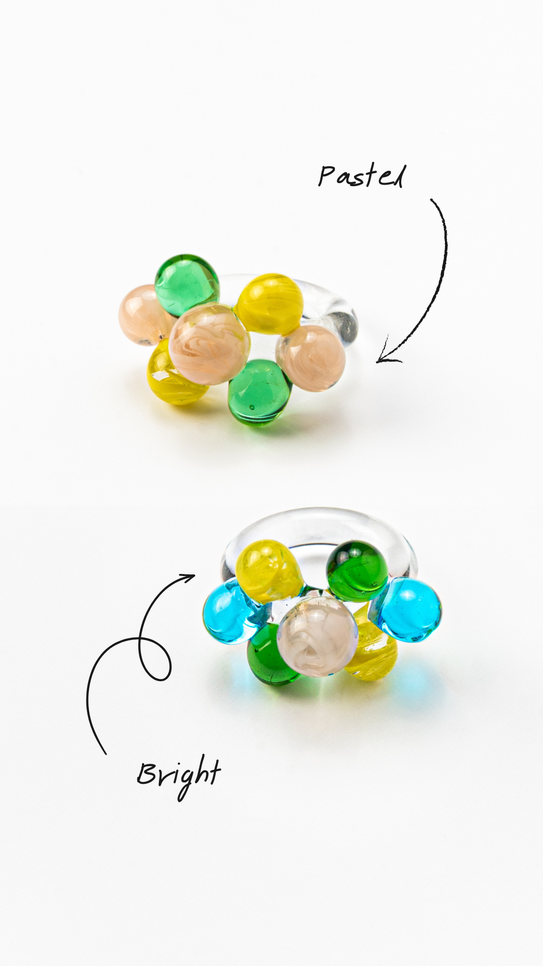 Two different variants of the same ring with glass spheres, bubbles in green, yellow, turquoise, and peach tones, made from recycled glass.