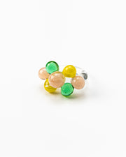 Clear ring with glass spheres, bubbles in green, yellow, and peach tones, made from recycled glass.
