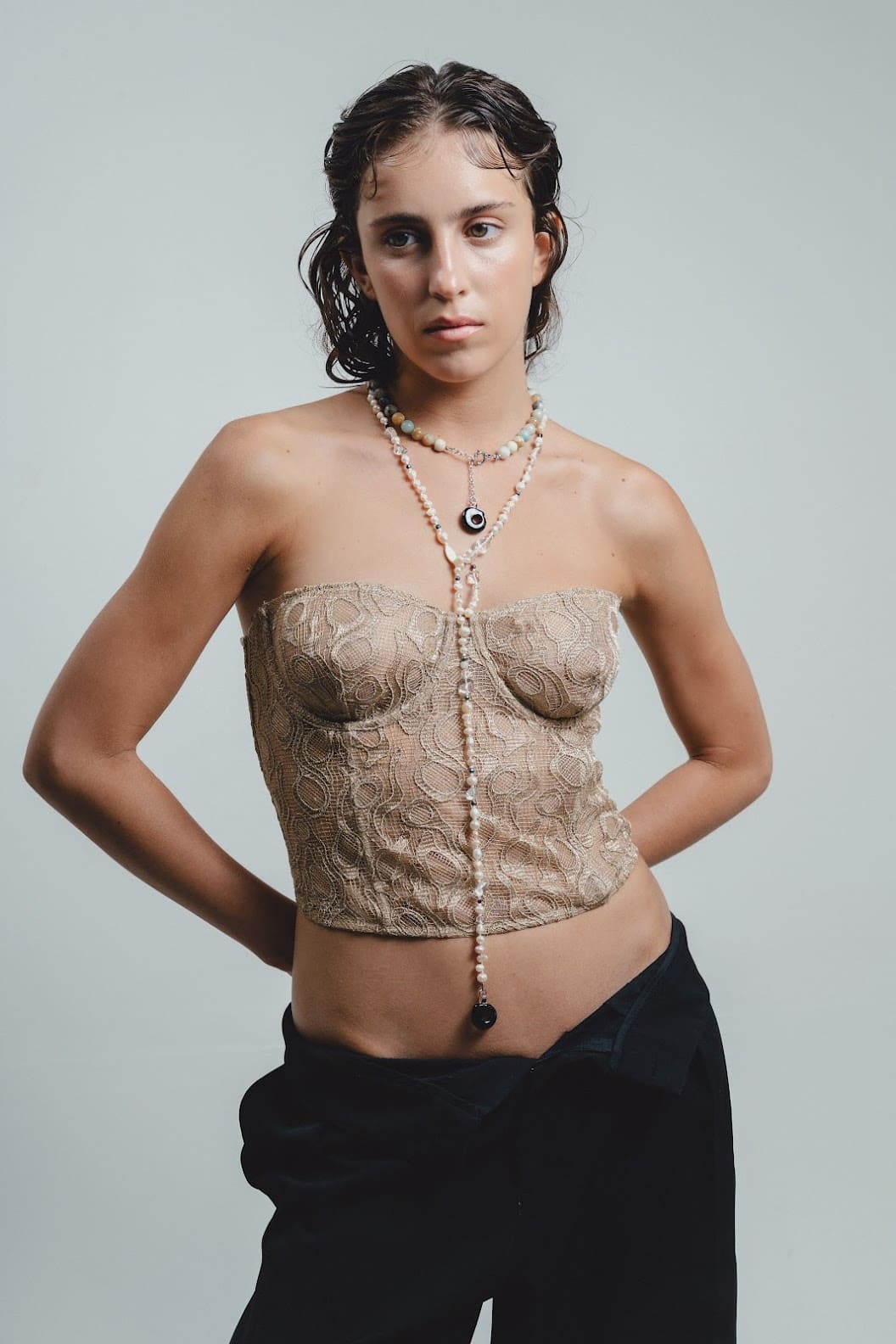 Woman wearing river pearl necklace